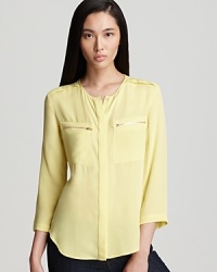 This lovely lightweight Theory top saunters into fall in double-layered silk georgette and a warm melon hue. This lovely lightweight Theory top saunters into fall in double-layered silk georgette and a warm melon hue.