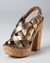 In bronze metallic leather, these gilded platforms get taken down a notch with the addition of a natural cork sole. From VINCE CAMUTO. In bronze metallic leather, these gilded platforms get taken down a notch with the addition of a natural cork sole. From VINCE CAMUTO.