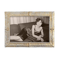 Sparkling starbright silver and lustrous dawn's gold highlight the textural patterns of this artfully handcrafted frame from Mariposa. Sparkling starbright silver and lustrous dawn's gold highlight the textural patterns of this artfully handcrafted frame from Mariposa.