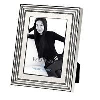 With a delicate inlay of ivory enamel over silver plating, this Vera Wang frame blends modern design with deco glamour for luxurious ambience. With a delicate inlay of ivory enamel over silver plating, this Vera Wang frame blends modern design with deco glamour for luxurious ambience.
