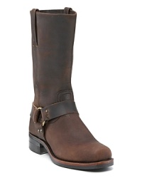 Distressed leather boots with leather strap detailing around the ankle. Leather pull-tab detailing on sides. Stacked heels, gripped bottoms. Distressed leather boots with leather strap detailing around the ankle. Leather pull-tab detailing on sides. Stacked heels, gripped bottoms.