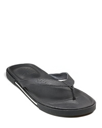 Leather insole wrapped in cushiony foam with TPU rubber outsole. Simple, casual thong sandals in leather. Leather insole wrapped in cushiony foam with TPU rubber outsole. Simple, casual thong sandals in leather.