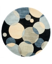 Abstract and absorbing, this rug features a multi-circle pattern in gray, taupe and an array of teal blues. Reminiscent of modern art paintings, it adds striking modernity and grace to your home. Hand-tufted and hand-carved of plush wool. Abstract and absorbing, this rug features a multi-circle pattern in gray, taupe and an array of teal blues. Reminiscent of modern art paintings, it adds striking modernity and grace to your home. Hand-tufted and hand-carved of plush wool.