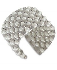 Light up the night. Carolee's wide cuff bracelet is crafted from silver-tone mixed metal with glass pearls and glass crystal accents adding a lustrous touch. Approximate diameter: 2-1/4 inches. Light up the night. Carolee's wide cuff bracelet is crafted from silver-tone mixed metal with glass pearls and glass crystal accents adding a lustrous touch. Approximate diameter: 2-1/4 inches.