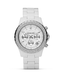 The chronograph is the new face of time. Here, from MICHAEL Michael Kors in bright white with crystal embellished bezel. With three-eye design and sweep second hand. The chronograph is the new face of time. Here, from MICHAEL Michael Kors in bright white with crystal embellished bezel. With three-eye design and sweep second hand.