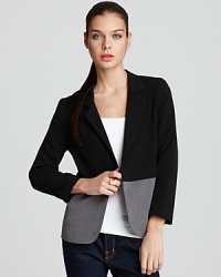 In minimalist black and grey, this Aqua blazer offers sleek, modern style that seamlessly transitions from day to night. In minimalist black and grey, this Aqua blazer offers sleek, modern style that seamlessly transitions from day to night.