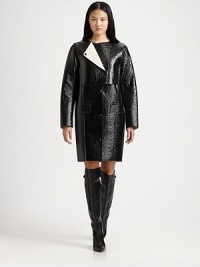Lustrous, lacquered coat has an asymmetrical overlay, oversized sleeves and a length that hits just above the knee. RoundneckZippered asymmetrical overlayLong sleevesButton frontFront pocketsFully linedAbout 36 from shoulder to hemLacquered 90% cotton/10% viscoseDry cleanImported of Italian fabricModel shown is 5'10 (177cm) wearing US size 2. Lustrous, lacquered coat has an asymmetrical overlay, oversized sleeves and a length that hits just above the knee. RoundneckZippered asymmetrical overlayLong sleevesButton frontFront pocketsFully linedAbout 36 from shoulder to hemLacquered 90% cotton/10% viscoseDry cleanImported of Italian fabricModel shown is 5'10 (177cm) wearing US size 2.
