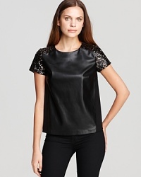The classic tee goes rocker luxe as sleek faux-leather and studded sleeves toughen up this DKNYC top. Style with skinny jeans and rock n' roll to the top of the fashion charts. The classic tee goes rocker luxe as sleek faux-leather and studded sleeves toughen up this DKNYC top. Style with skinny jeans and rock n' roll to the top of the fashion charts.