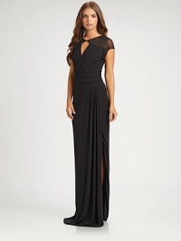 Elegant and modern, this evening-perfect style features an alluring front keyhole.Jewel neckline with keyhole detailSheer cap sleevesRuched waistSide slitConcealed back zipFully linedAbout 48 from natural waistViscoseDry cleanImportedModel shown is 5'10 (177cm) wearing US size 4. Elegant and modern, this evening-perfect style features an alluring front keyhole.Jewel neckline with keyhole detailSheer cap sleevesRuched waistSide slitConcealed back zipFully linedAbout 48 from natural waistViscoseDry cleanImportedModel shown is 5'10 (177cm) wearing US size 4.