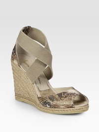Stretchy canvas and snake-embossed leather straps, elevated by a braided espadrille wedge. Hemp-covered wedge, 4 (100mm)Covered platform, ½ (15mm)Compares to a 3½ heel (90mm)Canvas and snake-embossed leather upperLeather and hemp liningRubber soleImported Stretchy canvas and snake-embossed leather straps, elevated by a braided espadrille wedge. Hemp-covered wedge, 4 (100mm)Covered platform, ½ (15mm)Compares to a 3½ heel (90mm)Canvas and snake-embossed leather upperLeather and hemp liningRubber soleImported