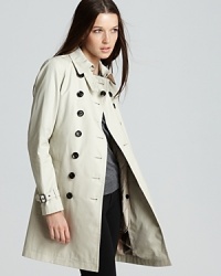 The classic Burberry Brit trench coat gains cold-weather credo with an inner warmer for a cozy yet chic approach to the rainiest of days. The classic Burberry Brit trench coat gains cold-weather credo with an inner warmer for a cozy yet chic approach to the rainiest of days.