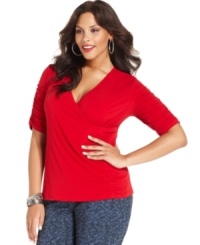 A wrap front lends a chic finish to Style&co.'s elbow sleeve plus size top. A wrap front lends a chic finish to Style&co.'s elbow sleeve plus size top.