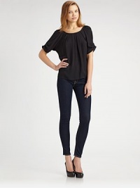 Breezy silk silhouette with a drawstring that pulls in the neckline and ends with a bow at the back. Scoopneck Gathered short sleeves About 22 from shoulder to hem Silk Dry clean Imported Breezy silk silhouette with a drawstring that pulls in the neckline and ends with a bow at the back. Scoopneck Gathered short sleeves About 22 from shoulder to hem Silk Dry clean Imported