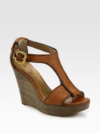 Rich pebbled leather with an adjustable t-strap and stacked wedge. Stacked wedge, 4 (100mm)Stacked platform, 1 (25mm)Compares to a 3 heel (75mm)Leather upperLeather lining and solePadded insoleMade in ItalyOUR FIT MODEL RECOMMENDS ordering true size. Rich pebbled leather with an adjustable t-strap and stacked wedge. Stacked wedge, 4 (100mm)Stacked platform, 1 (25mm)Compares to a 3 heel (75mm)Leather upperLeather lining and solePadded insoleMade in ItalyOUR FIT MODEL RECOMMENDS ordering true size.