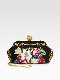 A cotton cross-stitch style in a floral design with leather trim and a convenient concealable chain strap.Concealable chain shoulder strap, 23½ dropEmbellished top clasp closureOne inside zip pocketSatin lining15W X 8½H X 3½DMade in Italy A cotton cross-stitch style in a floral design with leather trim and a convenient concealable chain strap.Concealable chain shoulder strap, 23½ dropEmbellished top clasp closureOne inside zip pocketSatin lining15W X 8½H X 3½DMade in Italy