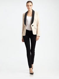 Iconic tuxedo blazer with contrasting leather lapels for a refreshing approach to timeless tailoring. Leather lapelsLong sleeves with buttoned cuffsSingle button closureFront flap pocketsAbout 24 from shoulder to hemBody: Wool/polyester/LyocellTrim: LeatherDry clean with leather specialistMade in USA of imported fabricModel shown is 5'10 (177cm) wearing US size 4. Iconic tuxedo blazer with contrasting leather lapels for a refreshing approach to timeless tailoring. Leather lapelsLong sleeves with buttoned cuffsSingle button closureFront flap pocketsAbout 24 from shoulder to hemBody: Wool/polyester/LyocellTrim: LeatherDry clean with leather specialistMade in USA of imported fabricModel shown is 5'10 (177cm) wearing US size 4.