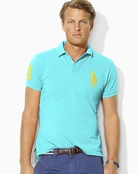 A trim-fitting mesh polo is taken to the extreme end of the color spectrum in this updated neon version, helping the gentleman confident in his style to stand out for all the right reasons. A trim-fitting mesh polo is taken to the extreme end of the color spectrum in this updated neon version, helping the gentleman confident in his style to stand out for all the right reasons.