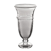 Mouth blown by artisans in the hills outside Prague, this elegant glass vase features Juliska's signature thread-and-berry detailing. Each individual piece has its own individual character, showcasing small bubbles and slight variations in color and size. Mouth blown by artisans in the hills outside Prague, this elegant glass vase features Juliska's signature thread-and-berry detailing. Each individual piece has its own individual character, showcasing small bubbles and slight variations in color and size.