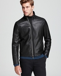 Gentlemen, start your engines. This moto design from John Varvatos USA LUXE provides an authentic look in refined leather, perfect for your high-paced lifestyle. Gentlemen, start your engines. This moto design from John Varvatos USA LUXE provides an authentic look in refined leather, perfect for your high-paced lifestyle.