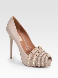Nappa leather style with an edgy studded front and a slight peep toe. Self-covered heel, 5 (125mm)Covered platform, 1 (25mm)Compares to a 4 heel (100mm)Nappa leather upperLeather lining and solePadded insoleMade in ItalyOUR FIT MODEL RECOMMENDS ordering one half size up as this style runs small. Nappa leather style with an edgy studded front and a slight peep toe. Self-covered heel, 5 (125mm)Covered platform, 1 (25mm)Compares to a 4 heel (100mm)Nappa leather upperLeather lining and solePadded insoleMade in ItalyOUR FIT MODEL RECOMMENDS ordering one half size up as this style runs small.