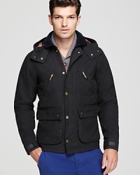 Industrial inspired with a military edge, this hooded jacket boasts a contrast drawstring hood with angled zips, buttoned flap pockets and Velcro tabs at the cuffs. Industrial inspired with a military edge, this hooded jacket boasts a contrast drawstring hood with angled zips, buttoned flap pockets and Velcro tabs at the cuffs.
