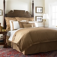 Self-corded and self-backed with diamond stitching, this comforter is embellished with open lattice stitching at the edges.