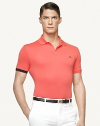 A sleek zipper replaces the conventional button front on a trim polo constructed from luxurious mercerized cotton. A sleek zipper replaces the conventional button front on a trim polo constructed from luxurious mercerized cotton.