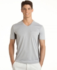 Stay at the top of your game. You'll be in good shape no matter where you sport this striped performance shirt from Calvin Klein Jeans. Stay at the top of your game. You'll be in good shape no matter where you sport this striped performance shirt from Calvin Klein Jeans.