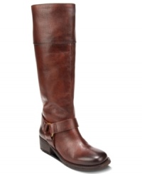 Uniquely sleek. Lucky Brand's Abeni boots have a strap across the vamp with a metal ring detail on the side.