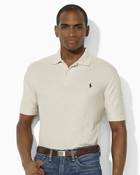 Cut with a wider body and longer hem, an iconic polo shirt in breathable cotton mesh is designed with a subtle heathered effect for a well-worn, vintage look. Cut with a wider body and longer hem, an iconic polo shirt in breathable cotton mesh is designed with a subtle heathered effect for a well-worn, vintage look.