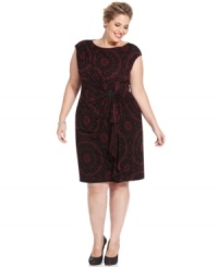 This plus size lace-print dress by Jones New York is gathered at the waist with a jeweled brooch as a fabulous finishing touch. This plus size lace-print dress by Jones New York is gathered at the waist with a jeweled brooch as a fabulous finishing touch.
