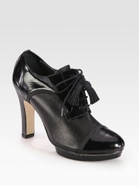 Grosgrain trim and double tassels add polish to this platform staple of pebbled leather mixed with shiny patent. Self-covered heel, 4 (100mm)Covered platform, ½ (15mm)Compares to a 3½ heel (90mm)Leather and patent leather upper with grosgrain ribbon trimLeather liningLeather and rubber solePadded insoleMade in France Grosgrain trim and double tassels add polish to this platform staple of pebbled leather mixed with shiny patent. Self-covered heel, 4 (100mm)Covered platform, ½ (15mm)Compares to a 3½ heel (90mm)Leather and patent leather upper with grosgrain ribbon trimLeather liningLeather and rubber solePadded insoleMade in France
