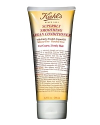 Formulated with fairly-traded Argan Oil and Safflower Oil, our conditioner moisturizes, detangles, and provides intensive smoothing and longlasting shine with a frizz-free finish. Silicone and Paraben-Free Formula. Effectively smooths hair without weighing it down, while preventing frizz and fly-aways. Formula also contains emollient Cocoa Butter to add moisture and shine. Imparts a sleeker, more manageable look and feel to hair. Shampoo with Kiehl's Superbly Smoothing Argan Shampoo. Rinse and apply a generous amount of conditioner to hair, especially the ends. Gently work through the hair and leave on for two to three minutes. Rinse with lukewarm water. Style as usual.