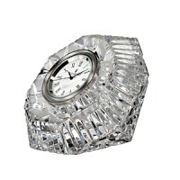 Timeless style for a brilliant time piece: this small crystal clock features the Lismore pattern's diamond-like facets; a gorgeous little display on any desk, mantle or bedside table. Timeless style for a brilliant time piece: this small crystal clock features the Lismore pattern's diamond-like facets; a gorgeous little display on any desk, mantle or bedside table.