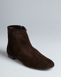 The model of mod style, these retro-chic Delman booties are highlighted by an abbreviated, trim silhouette. The model of mod style, these retro-chic Delman booties are highlighted by an abbreviated, trim silhouette.