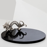 The grand form of a mythical dragon was the muse behind this sculptural serveware from Natori. Display a variety of cheeses and crackers on the beautiful, durable marble surface.