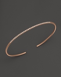 A simply modern diamond bangle in 14K rose gold from Meira T. A simply modern diamond bangle in 14K rose gold from Meira T.