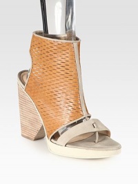 Perforated leather upper has a stacked heel, thong front and smooth, contrasting trim. Stacked heel, 4 (100mm)Stacked platform, ½ (15mm)Compares to a 3½ heel (90mm)Leather upperSide zipperLeather lining and solePadded insoleMade in ItalyOUR FIT MODEL RECOMMENDS ordering one size up as this style runs small. Perforated leather upper has a stacked heel, thong front and smooth, contrasting trim. Stacked heel, 4 (100mm)Stacked platform, ½ (15mm)Compares to a 3½ heel (90mm)Leather upperSide zipperLeather lining and solePadded insoleMade in ItalyOUR FIT MODEL RECOMMENDS ordering one size up as this style runs small.