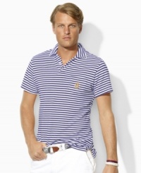 Rendered in breathable cotton mesh, a classic-fitting polo shirt with an embroidered crest and a heritage English placket is the epitome of refinement. Rendered in breathable cotton mesh, a classic-fitting polo shirt with an embroidered crest and a heritage English placket is the epitome of refinement.