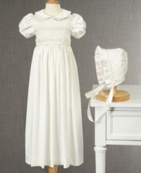 Pretty as a picture. Dress her in this beautiful smocked christening gown and bonnet from Cherish the Moment for memories that will last long after the day is over. Pretty as a picture. Dress her in this beautiful smocked christening gown and bonnet from Cherish the Moment for memories that will last long after the day is over.