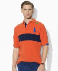 Rendered in breathable cotton mesh, Ralph Lauren's official limited edition US Open polo shirt embraces athletic style in sporty color-blocked design that's highlighted by a trim, modern fit. Rendered in breathable cotton mesh, Ralph Lauren's official limited edition US Open polo shirt embraces athletic style in sporty color-blocked design that's highlighted by a trim, modern fit.