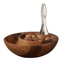 This Eclipse Nut Bowl in acacia wood, is ingeniously designed to houseboth whole nuts and their discarded shells in one gorgeous, nested vessel. The smaller bowl holdssweet almonds or salty pistachios, while the larger one waits to receive your guests' discardedshells.