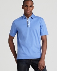 An essential polo gets a tweak from Michael Kors with check contrast details at the placket and under-collar, tailored for a slim, modern fit. An essential polo gets a tweak from Michael Kors with check contrast details at the placket and under-collar, tailored for a slim, modern fit.