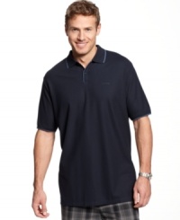 This classic polo shirt from Calvin Klein comes with tipping details to enhance your casual look. This classic polo shirt from Calvin Klein comes with tipping details to enhance your casual look.