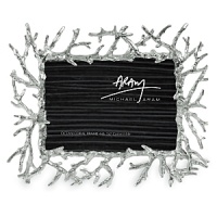 This striking frame provides a jewel-like platform for displaying a favorite image - perhaps that portrait of the family taken on the beach. It features intertwined coral branches growing out from a central frame. This striking frame provides a jewel-like platform for displaying a favorite image - perhaps that portrait of the family taken on the beach. It features intertwined coral branches growing out from a central frame.