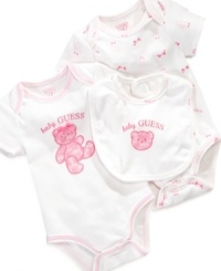 This GUESS? bodysuits set for her includes an adorable bib embroidered with a pink bear. This GUESS? bodysuits set for her includes an adorable bib embroidered with a pink bear.