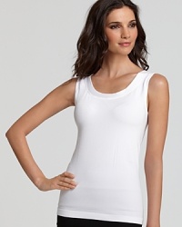 A long tank top with a body skimming silhouette in a seamless knitting technique. Great for layering or worn on its own. Style #051138 A long tank top with a body skimming silhouette in a seamless knitting technique. Great for layering or worn on its own. Style #051138