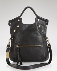 Bright stud detailing in gleaming gold tone and a bold tassel bring star style to Foley + Corinna's sleek leather tote. Bright stud detailing in gleaming gold tone and a bold tassel bring star style to Foley + Corinna's sleek leather tote.