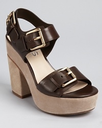 Bold buckles make an impression on KORS Michael Kors' Newman sandals, a chunky silhouette rendered in earthy teak-hued leather and finished with the softest suede. Bold buckles make an impression on KORS Michael Kors' Newman sandals, a chunky silhouette rendered in earthy teak-hued leather and finished with the softest suede.