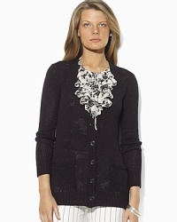A slightly open-knit construction lends lightweight layering sensibility to a classic cardigan. A slightly open-knit construction lends lightweight layering sensibility to a classic cardigan.